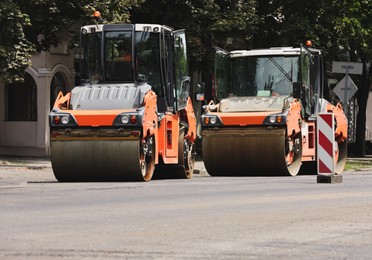 Image of Modern rollers working on city street. Road repair