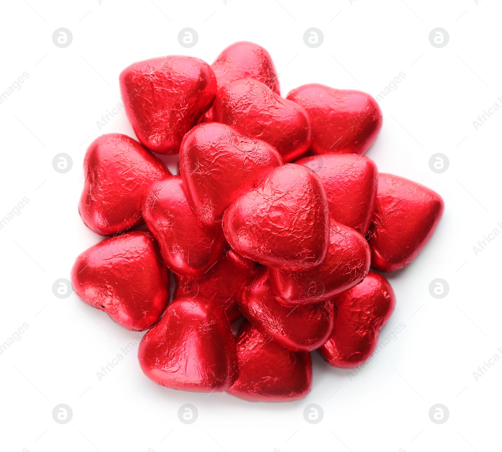 Photo of Heart shaped chocolate candies in red foil on white background, top view