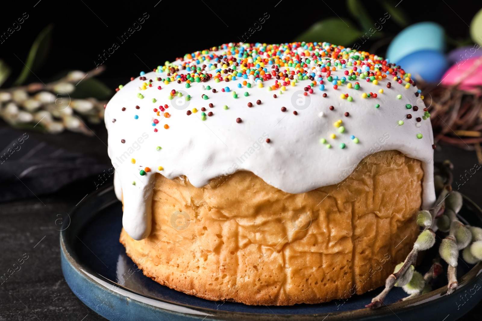 Photo of Traditional Easter cake on black table, closeup