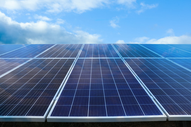 Image of Solar panels against blue sky. Alternative energy source