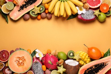 Photo of Different exotic fruits on beige background, flat lay. Space for text