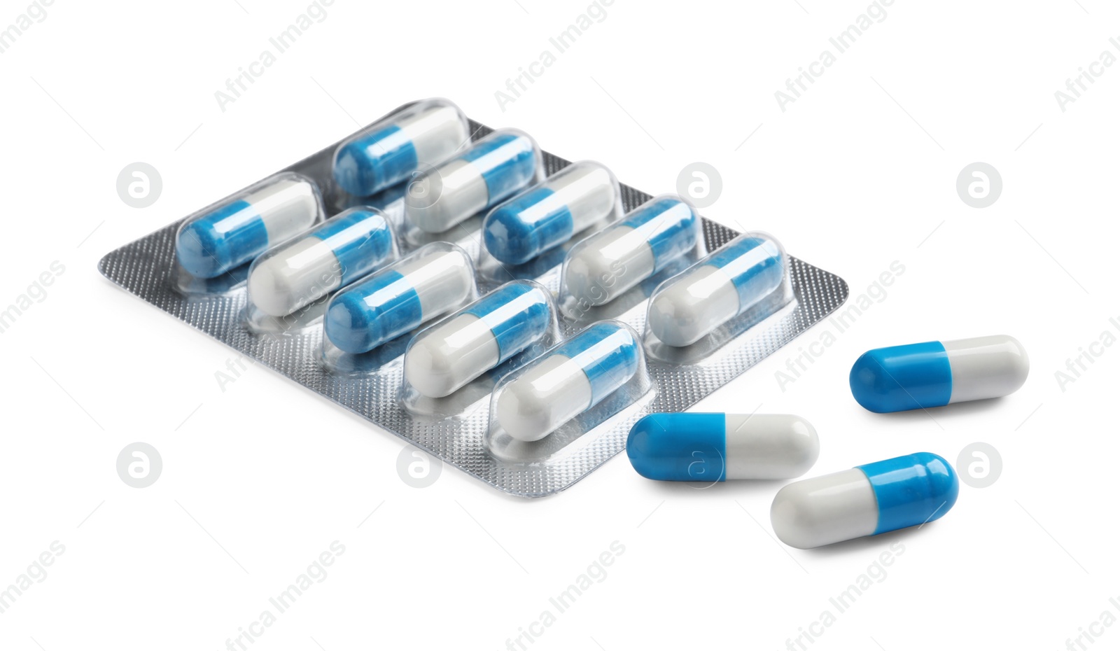Photo of Blister with bright pills on white background