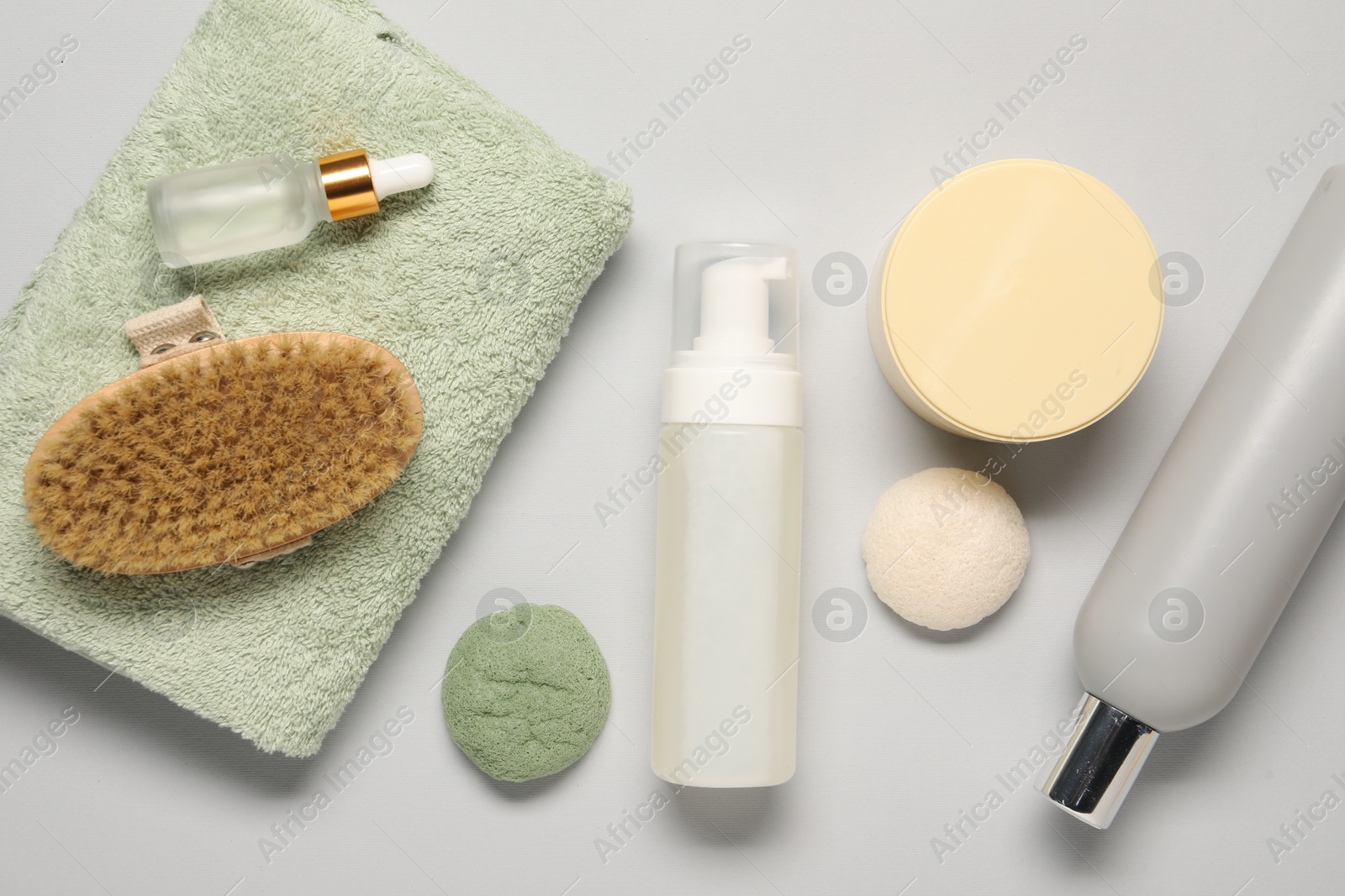 Photo of Bath accessories. Flat lay composition with personal care products on light grey background