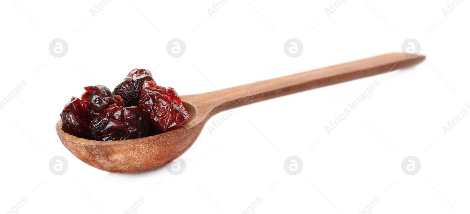 Photo of Dried cranberries in wooden spoon isolated on white
