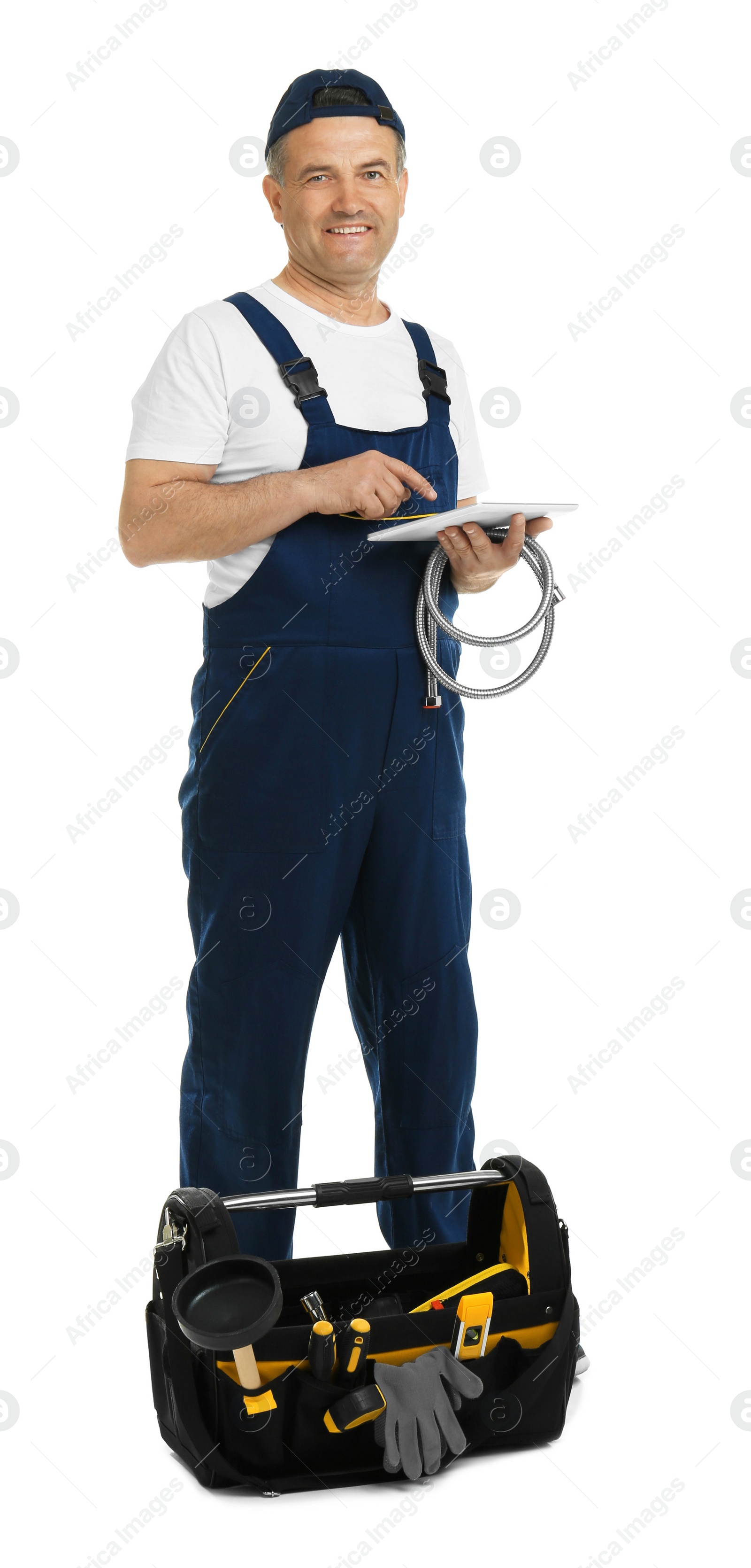 Photo of Mature plumber with tablet computer and hose on white background