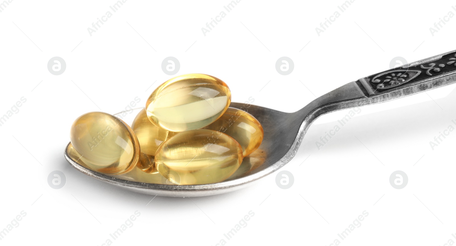 Photo of Spoon with cod liver oil pills on white background