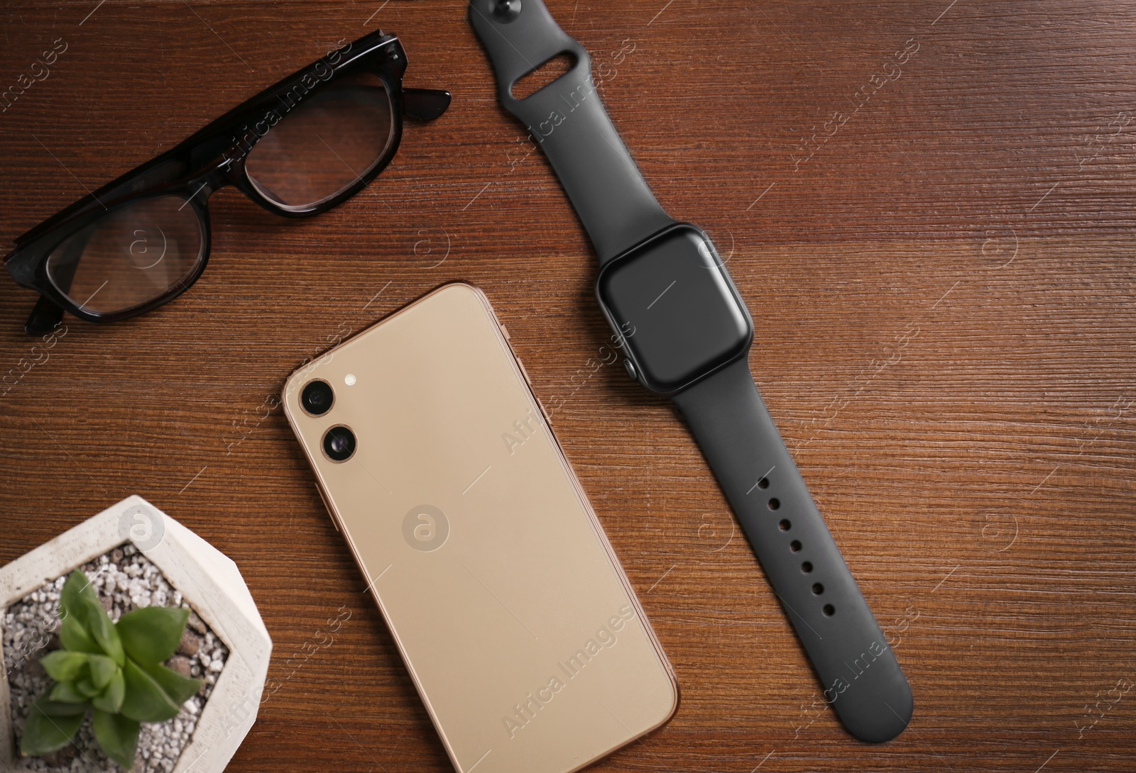 Flat lay composition with stylish smart watch on wooden table Photo of Flat lay composition with stylish smart watch on wooden table