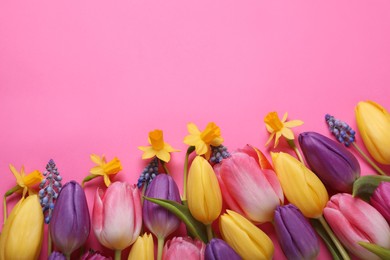 Beautiful different flowers on pink background, flat lay. Space for text