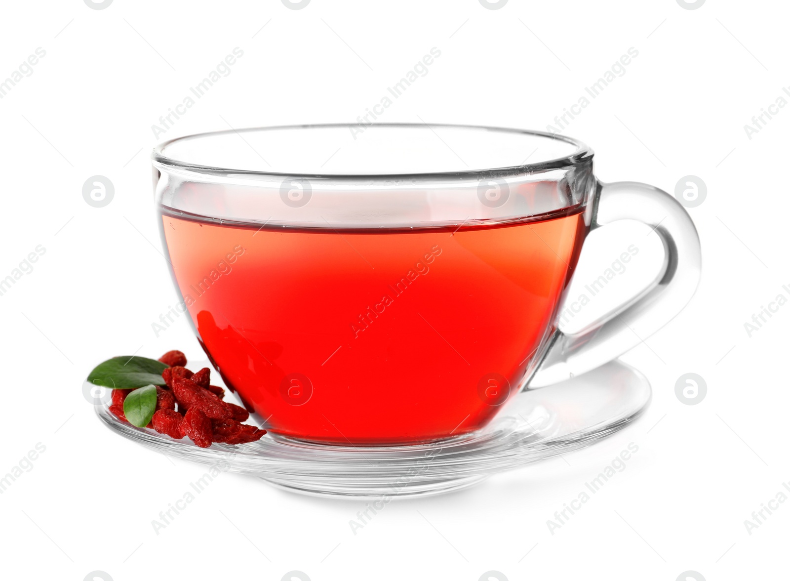 Photo of Healthy goji tea in glass cup with berries on white background