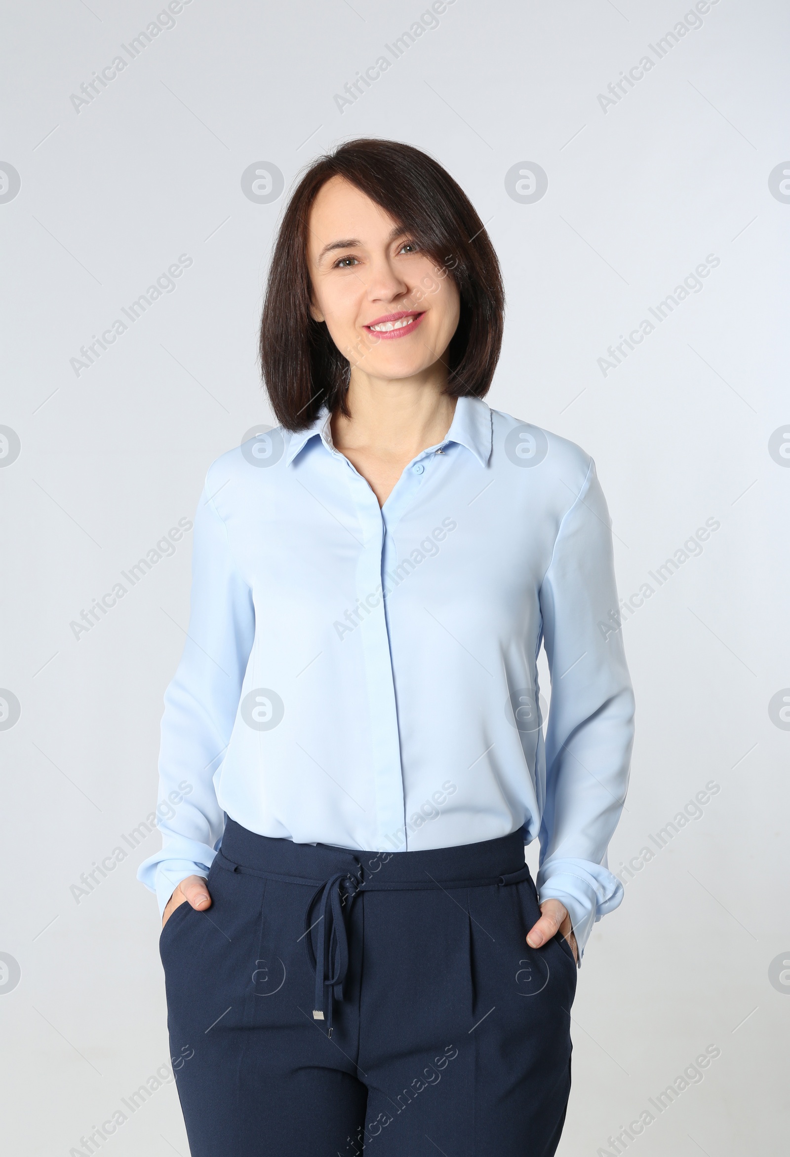 Photo of Portrait of mature businesswoman on white background
