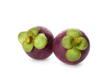 Photo of Delicious ripe mangosteen fruits on white background