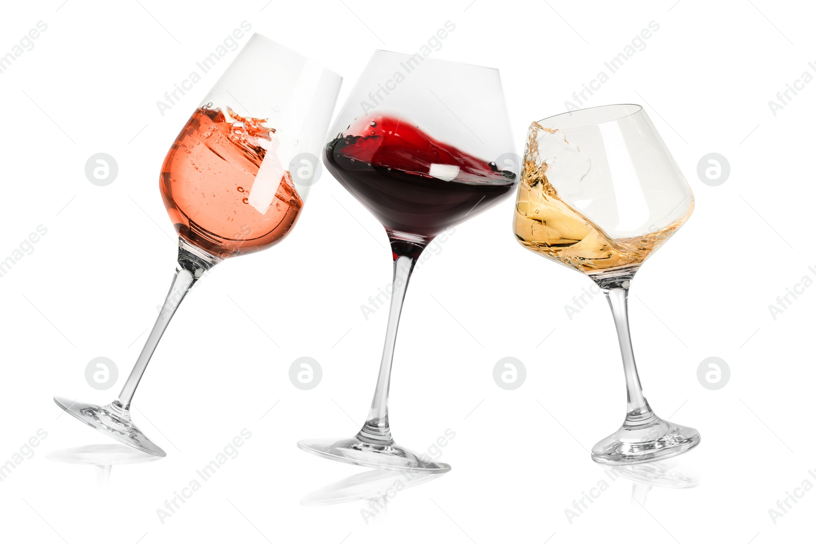 Image of Different types of wine splashing in glasses on white background