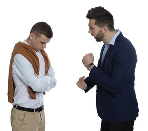 Businessman pointing on wrist watch while scolding employee for being late against white background