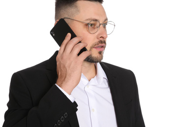 Businessman in glasses talking on smartphone against white background, closeup