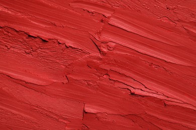 Texture of bright lipstick as background, top view