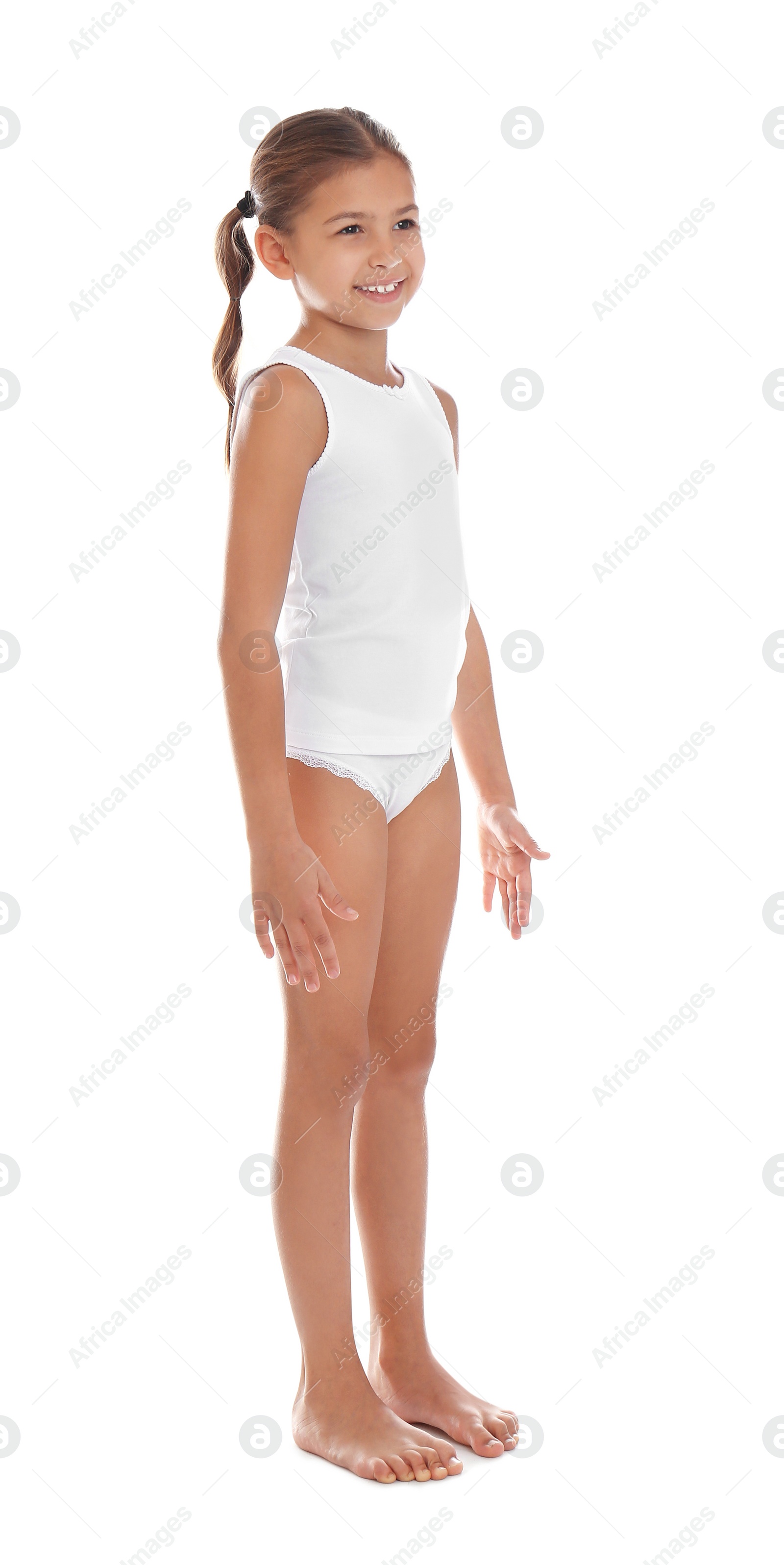 Photo of Cute little girl in underwear on white background