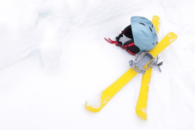 Photo of Ski equipment on snow, space for text. Winter vacation