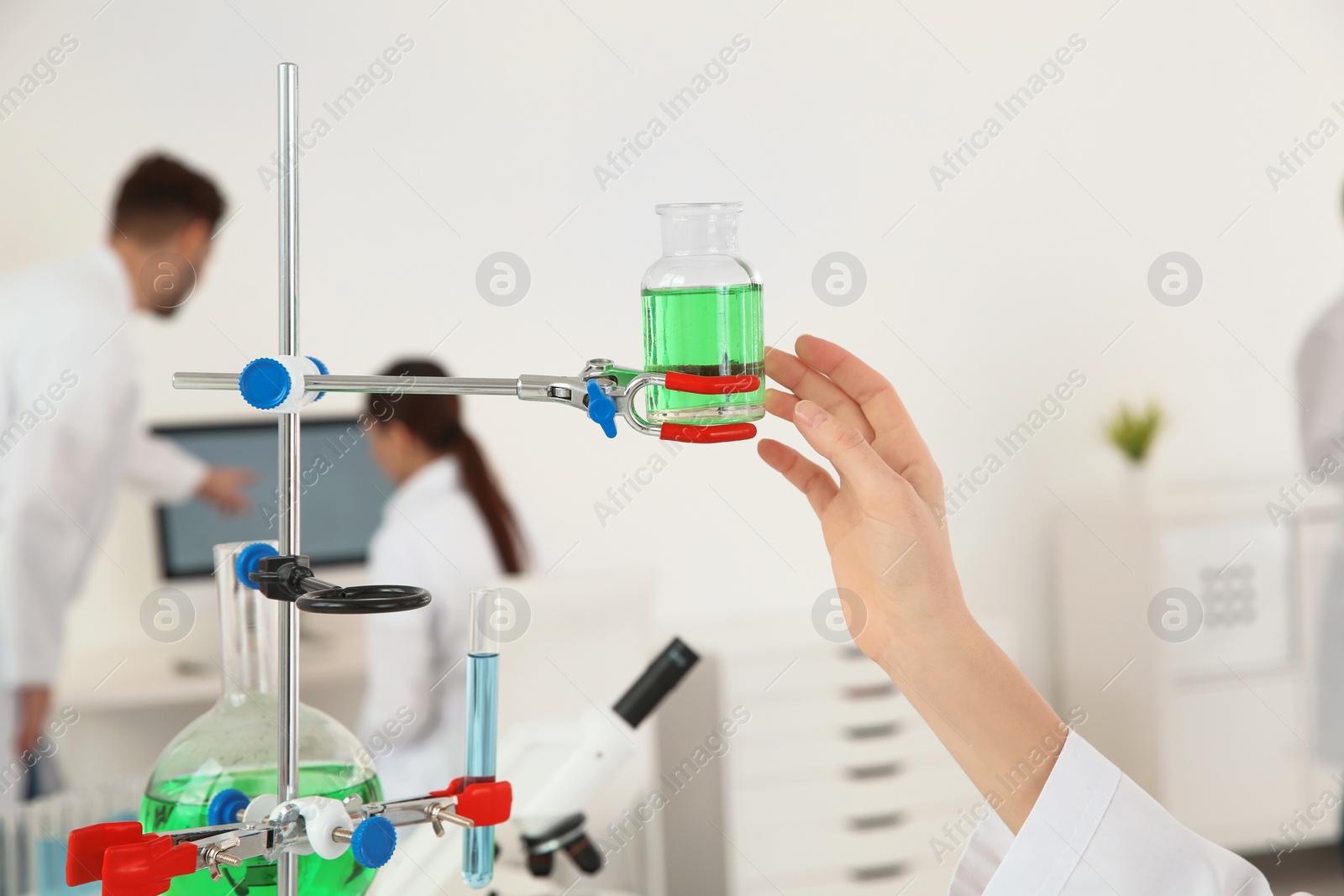 Photo of Medical student working in modern scientific laboratory, closeup