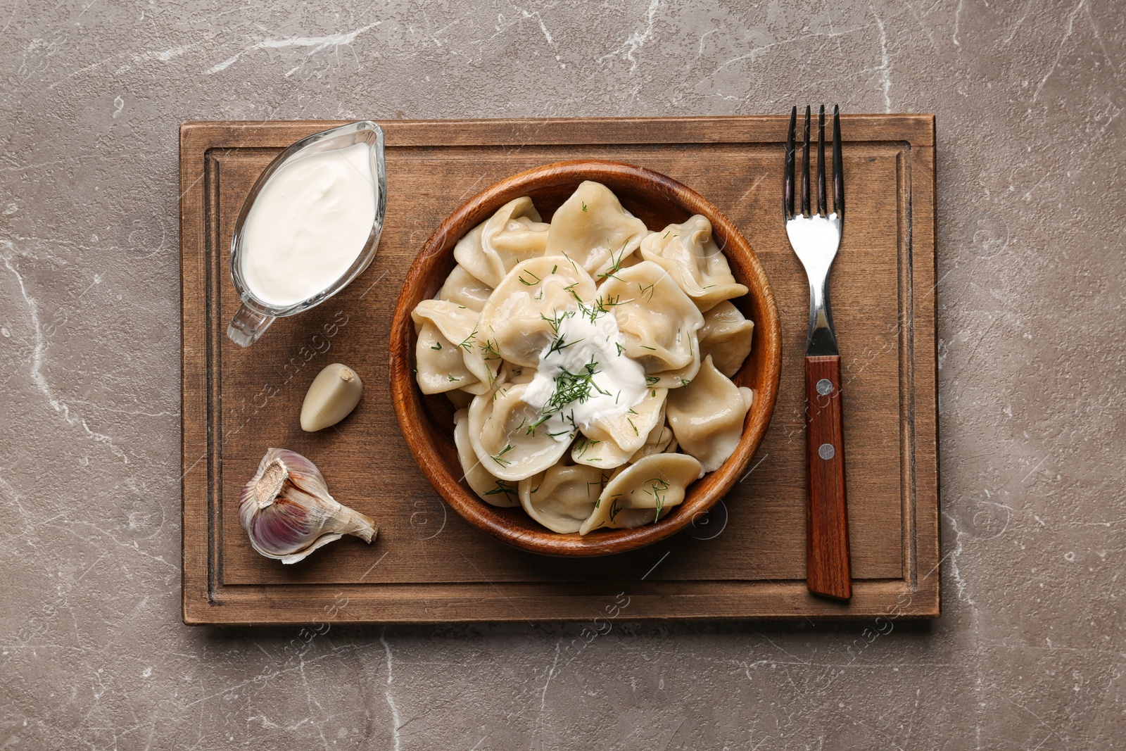 Photo of Flat lay composition with tasty dumplings on marble table