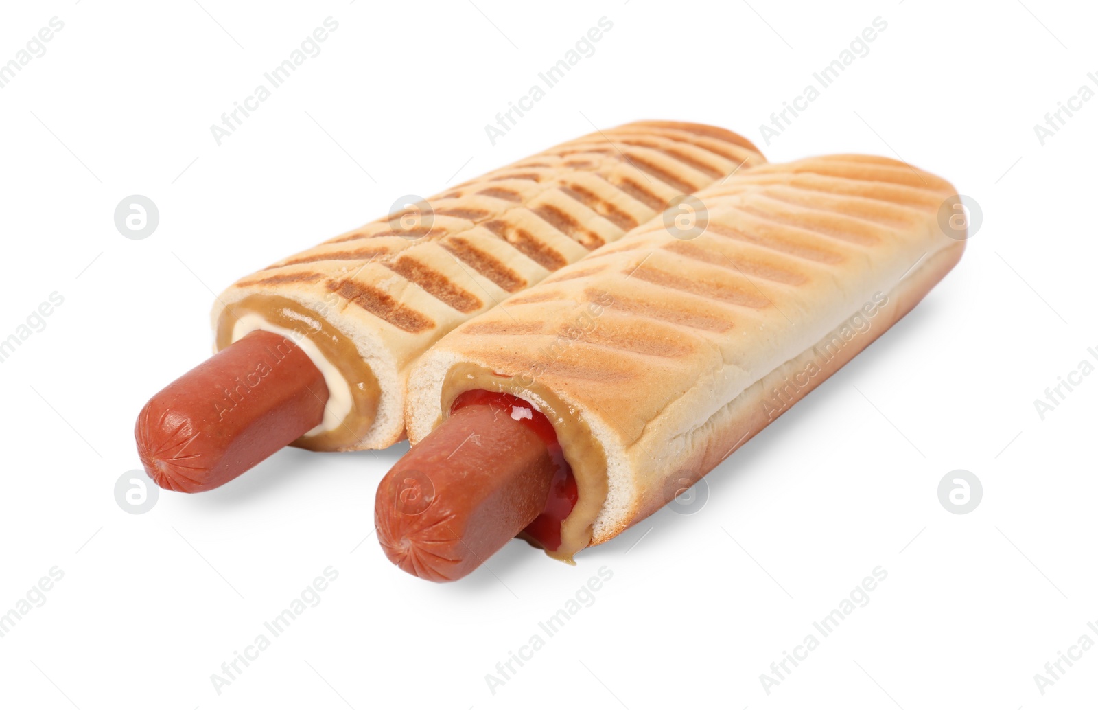 Photo of Tasty french hot dogs with different sauces on white background