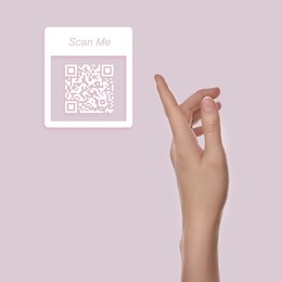 Woman pointing at illustration of QR code on lilac background, closeup