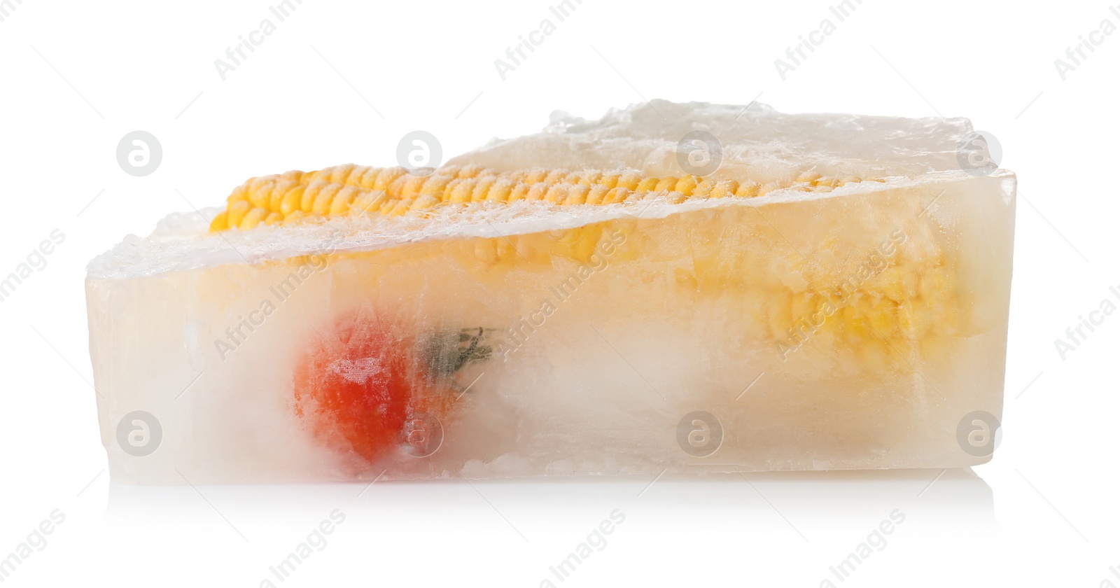 Photo of Fresh vegetables frozen in ice cube on white background