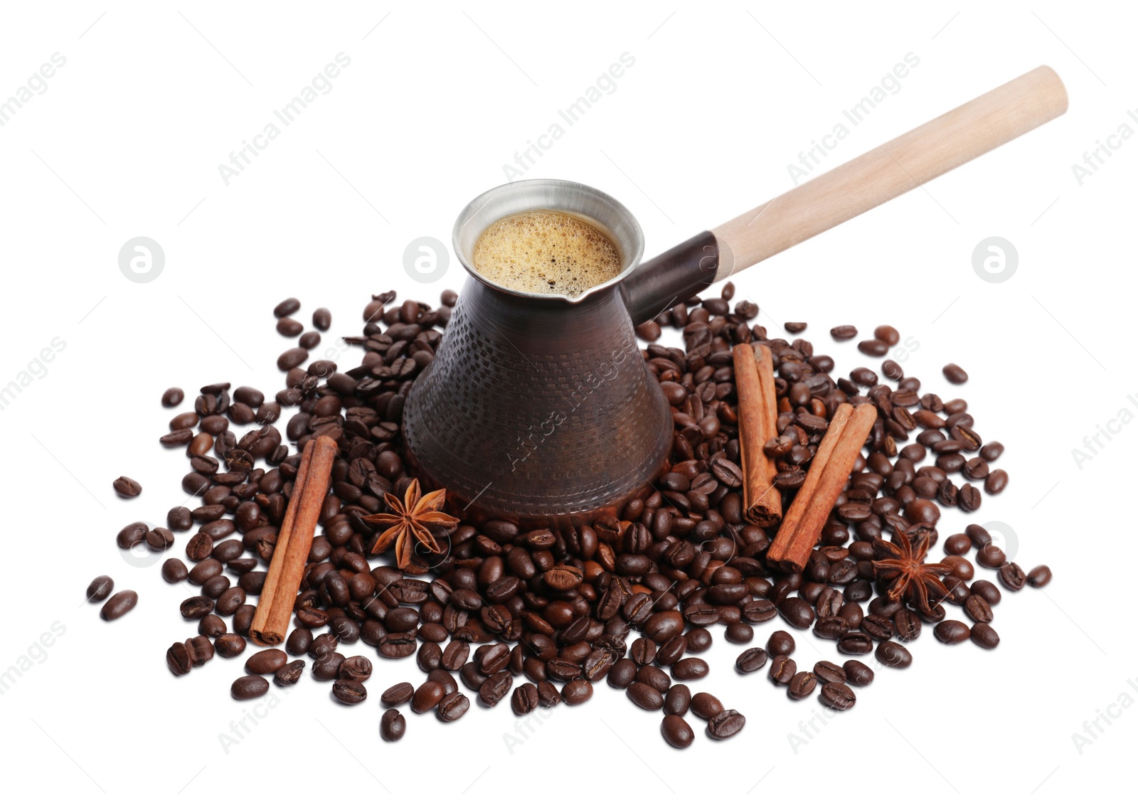Photo of Metal turkish coffee pot with hot drink, beans and spices on white background