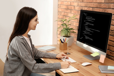 Image of Professional programmer working with computer in office