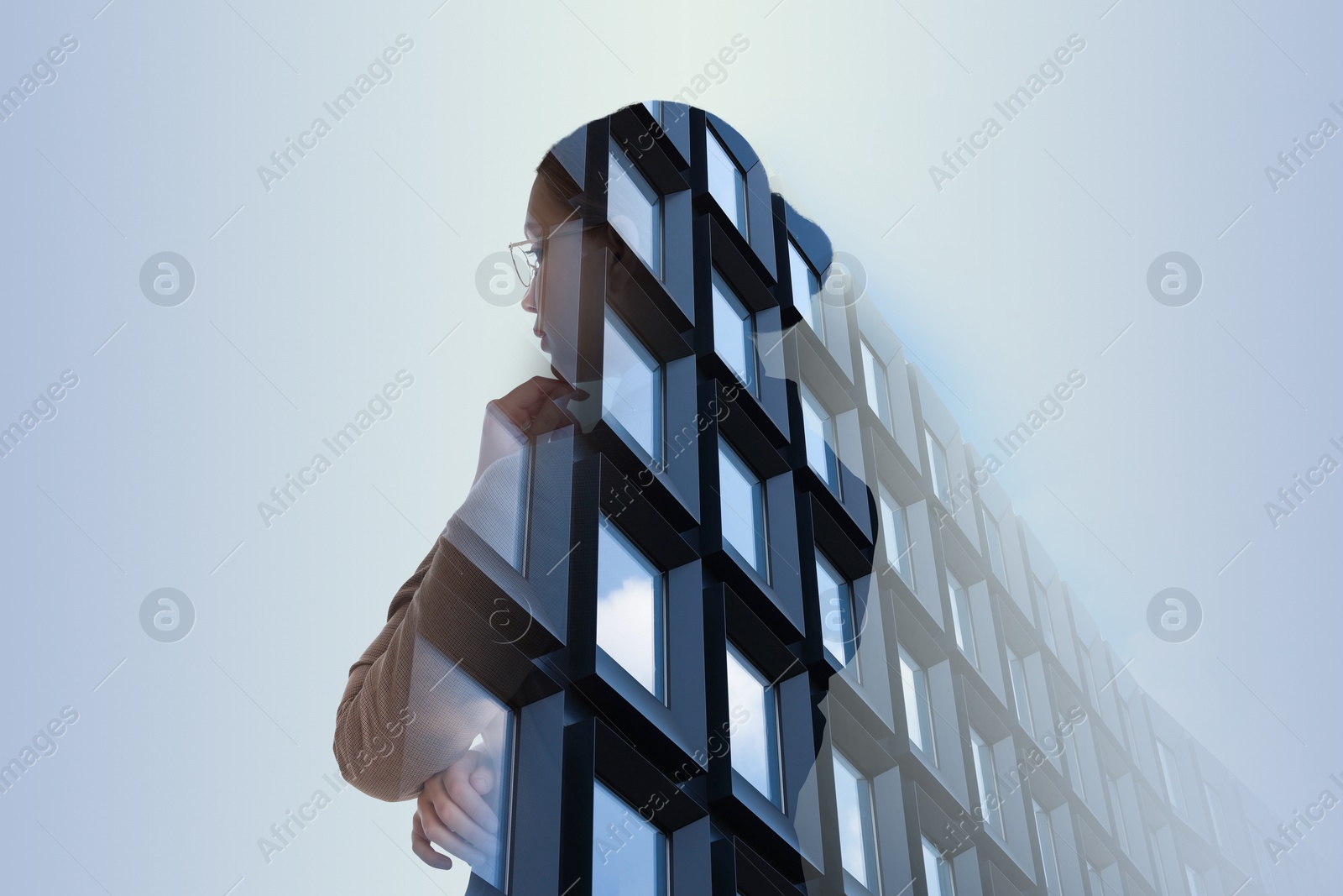 Image of Double exposure of businesswoman and office building