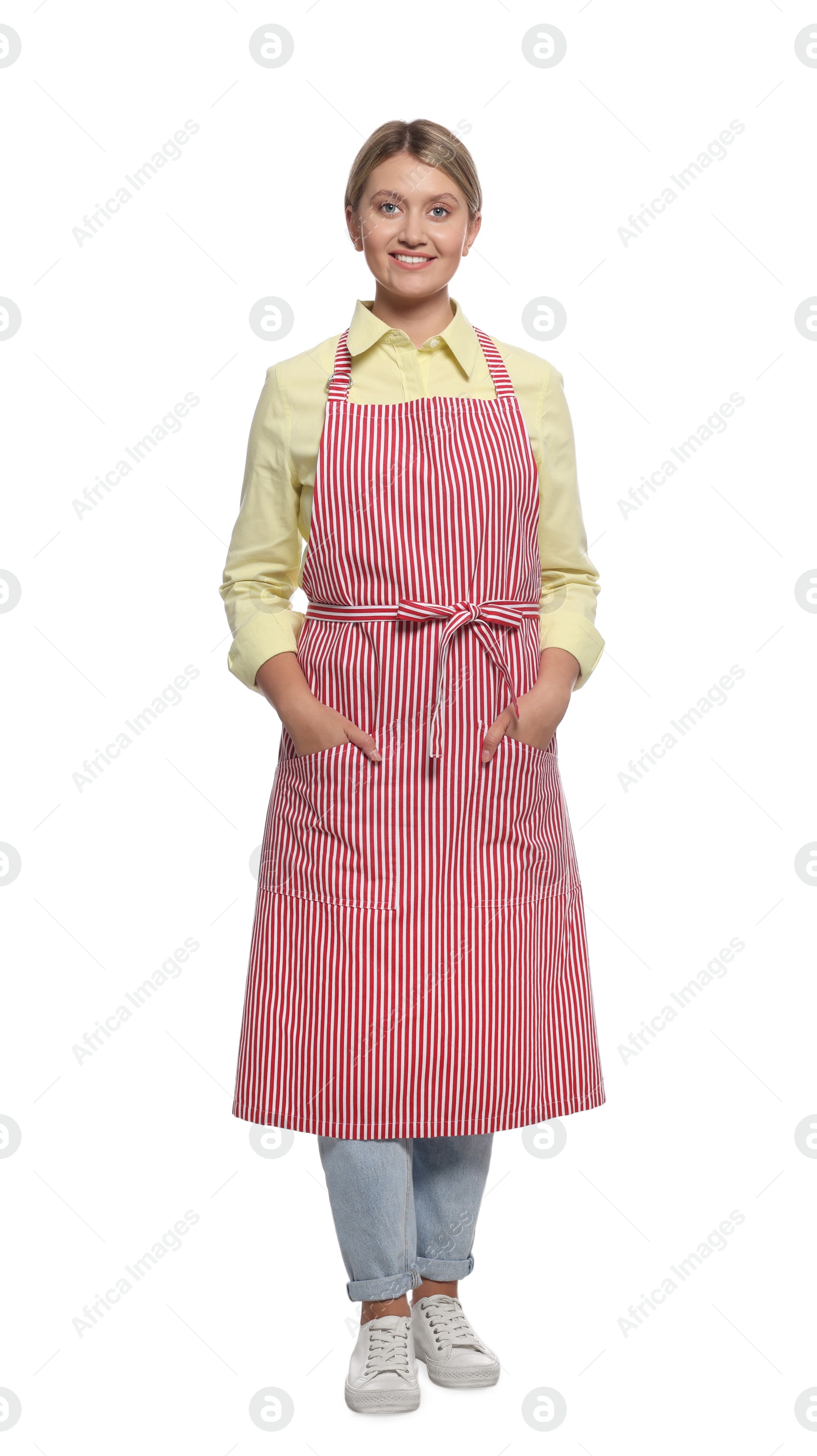 Photo of Beautiful young woman in clean striped apron on white background