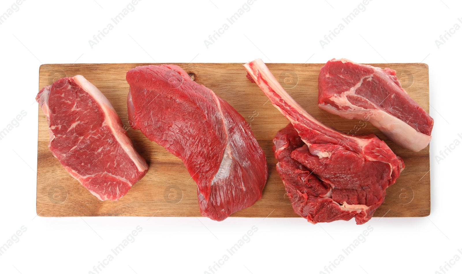 Photo of Board with pieces of raw beef meat isolated on white, top view