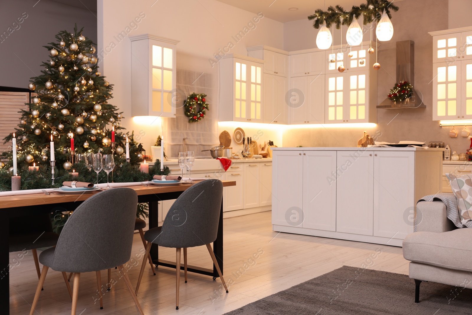 Photo of Cozy spacious kitchen decorated for Christmas. Interior design