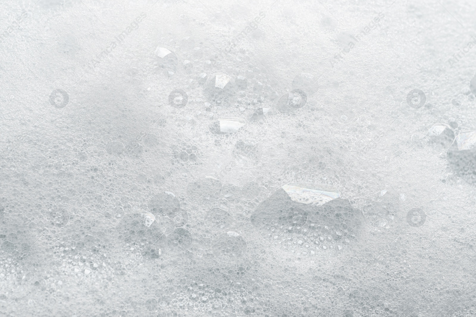 Photo of Fluffy soap foam as background, closeup view