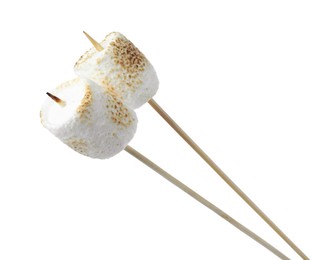 Sticks with roasted marshmallows on white background