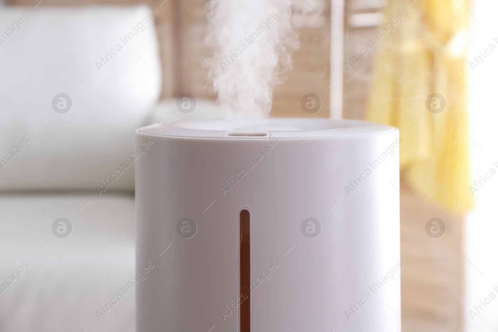 Photo of Modern air humidifier at home, closeup view