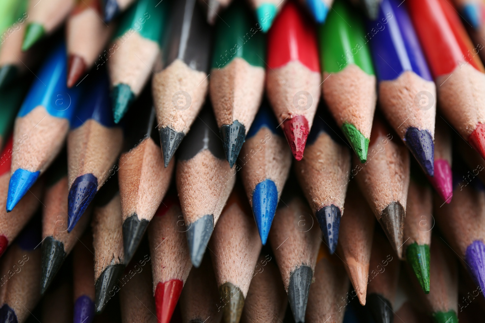 Photo of Different color pencils as background, closeup view