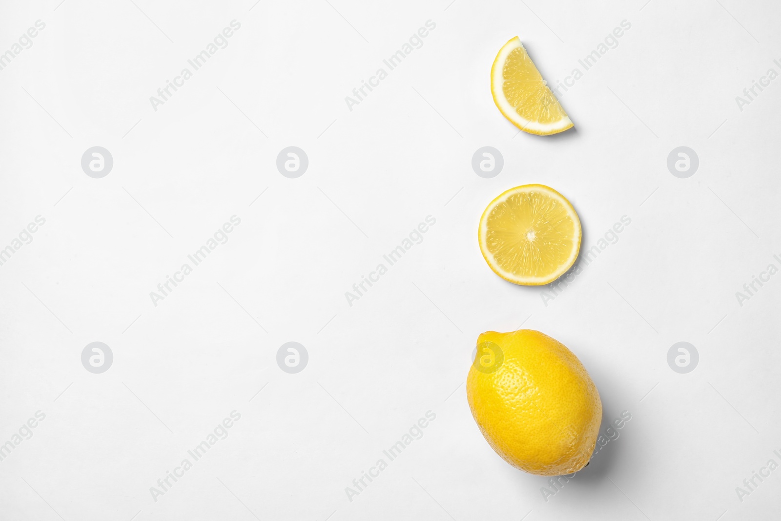 Photo of Beautiful composition with lemons on white background