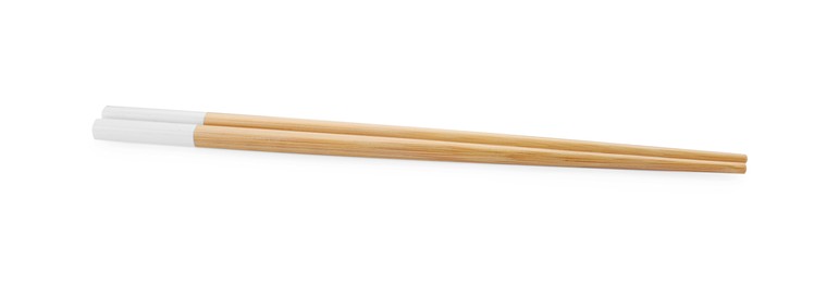Pair of wooden chopsticks isolated on white