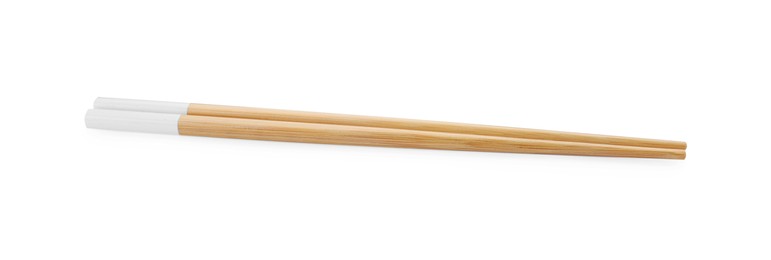 Photo of Pair of wooden chopsticks isolated on white