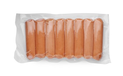 Photo of Vacuum pack with sausages isolated on white, top view. Meat product