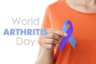 Image of World Arthritis Day. Woman with blue and purple awareness ribbon on white background, closeup
