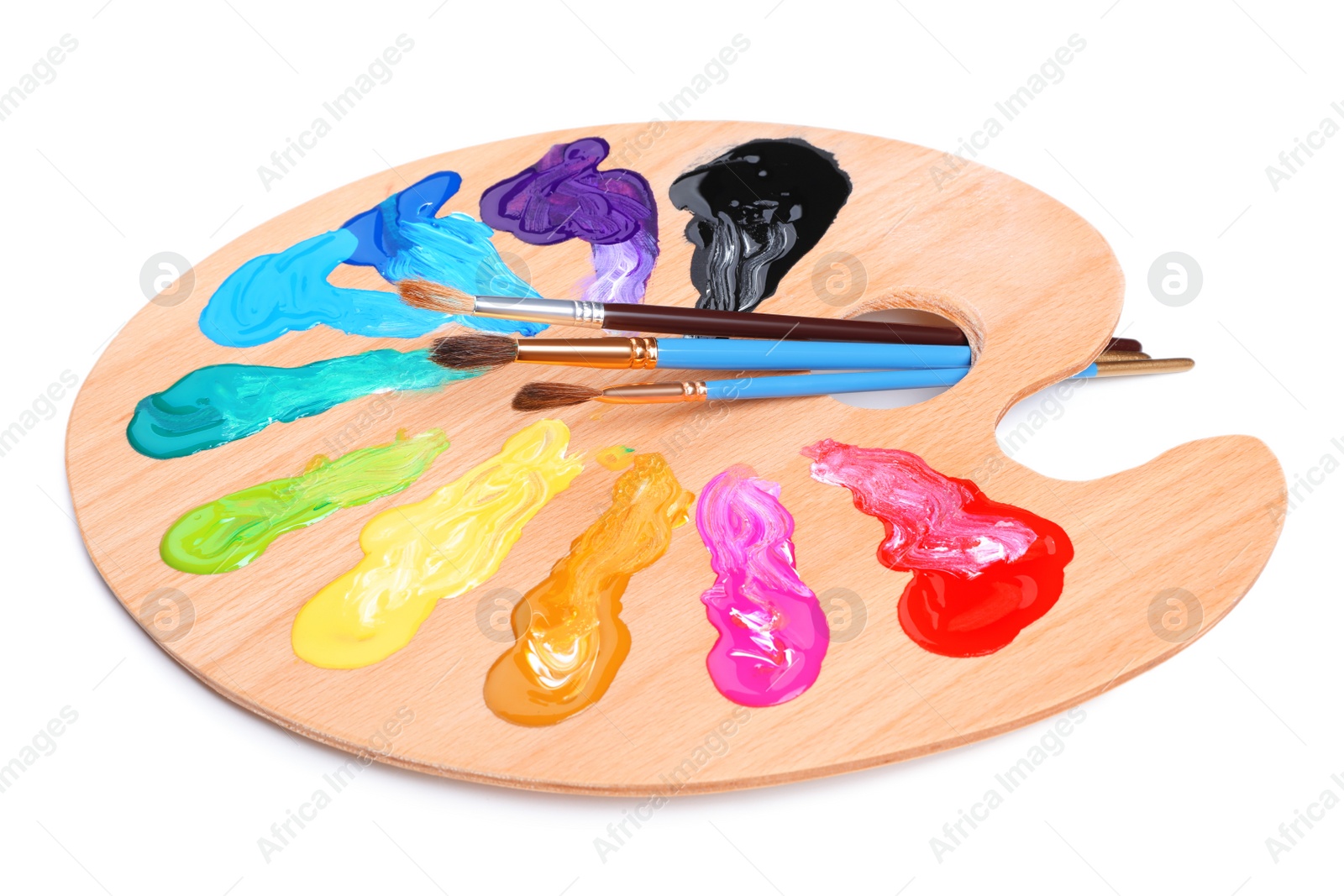 Photo of Palette with paints and brushes on white background. Artist equipment