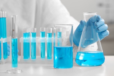 Photo of Scientist working with sample in laboratory, closeup