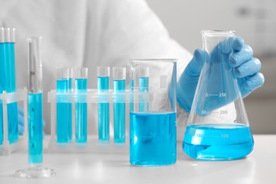 Scientist working with sample in laboratory, closeup