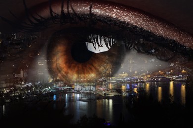 Image of Double exposure of night cityscape and woman with beautiful eye, closeup