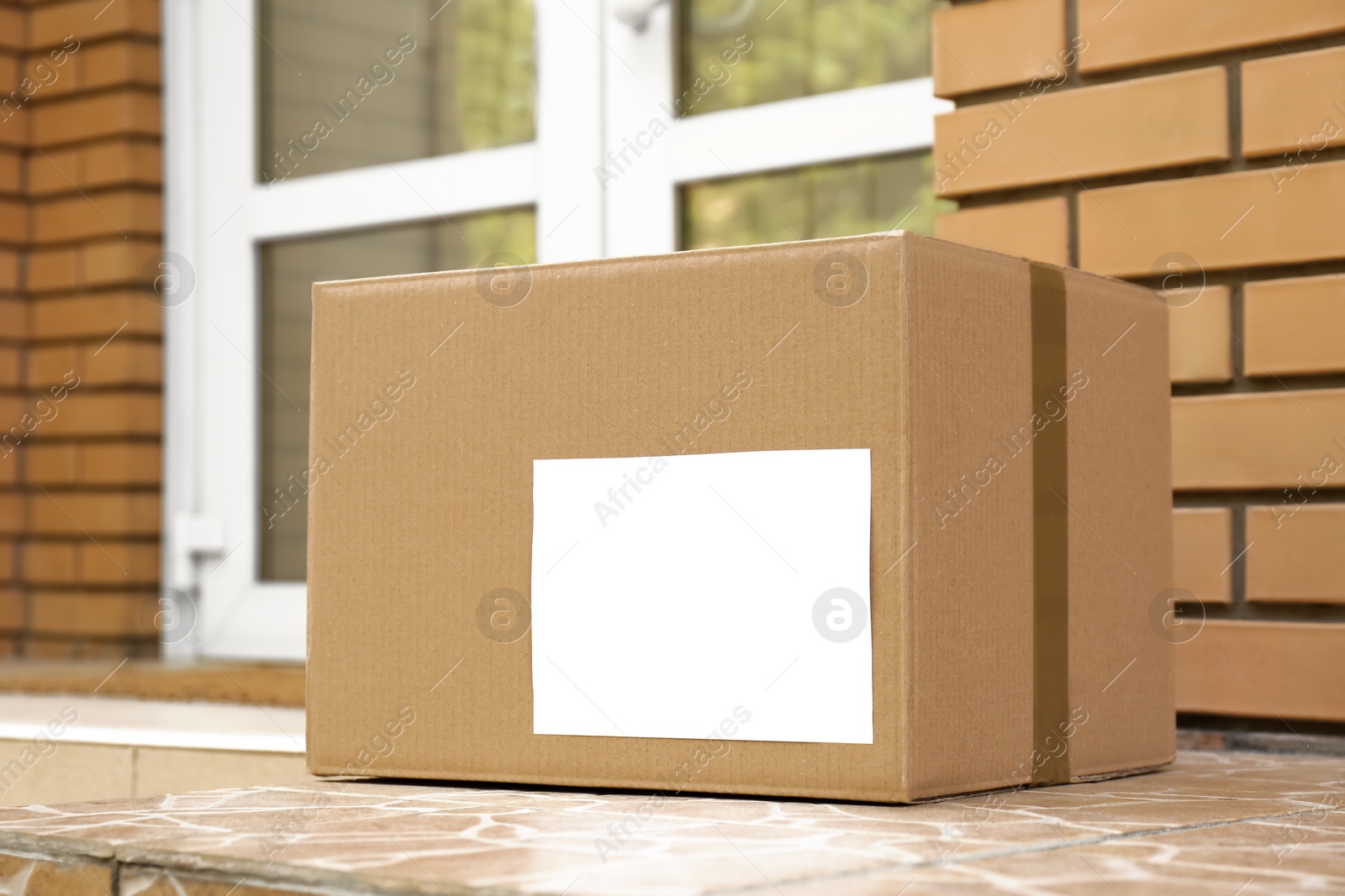 Photo of Delivered parcel on porch near front door