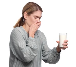 Photo of Woman with glass of milk suffering from lactose intolerance on white background