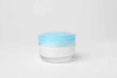 Photo of Jar of cosmetic product on light background