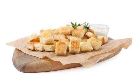 Delicious crispy croutons with rosemary and sauce on white background