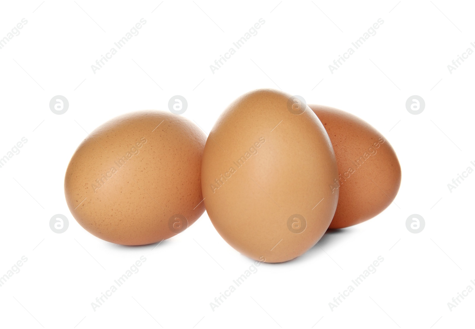 Photo of Raw brown chicken eggs on white background